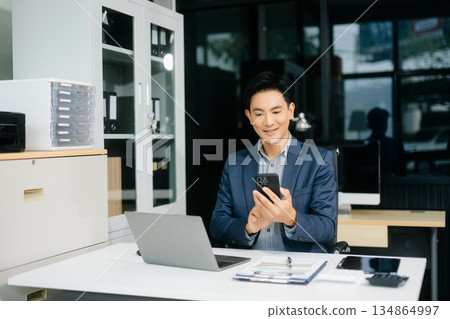Man freelancer is working her job on computer tablet and laptop Doing accounting analysis report real estate 134864997