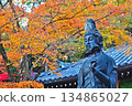 The Kannon Bodhisattva surrounded by autumn leaves 134865027