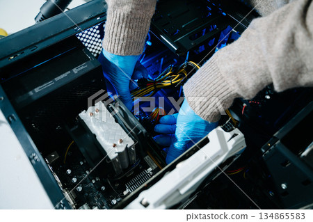 Electronics assembly and RAM installation with high-tech components. Ideal for showcasing advanced technology and computer engineering concepts Electronics assembly and RAM installation with high-tech components. Ideal for showcasing advanced technology and computer engineering concepts 134865583