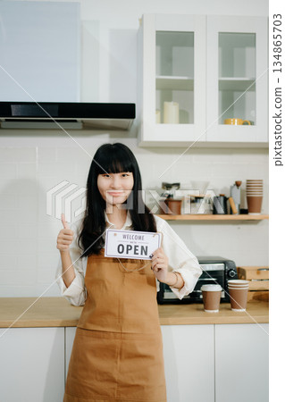 Startup successful small business owner sme woman stand with tablet in cafe restaurant. Startup successful small business owner sme woman stand with tablet in cafe restaurant. 134865703