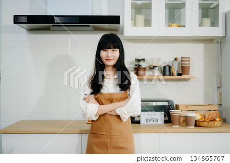 Startup successful small business owner sme woman stand with tablet  in cafe restaurant. 134865707