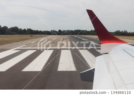 Commercial airplane before takeoff Bologna airport, Italy Commercial airplane before takeoff Bologna airport, Italy 134866110
