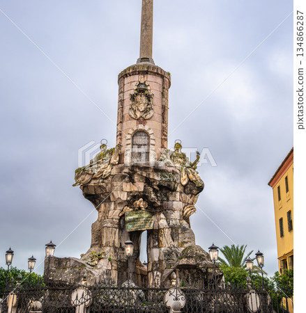 Historic monument with golden statue near Cordoba Cathedral in Spain. Historic monument with golden statue near Cordoba Cathedral in Spain. 134866287