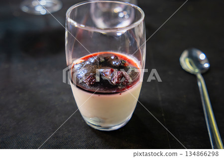 Panna cotta dessert with berry compote served in Consuegra, Spain. 134866298