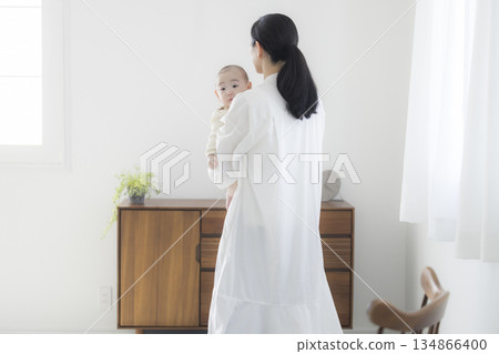 Young mother taking care of her baby 134866400