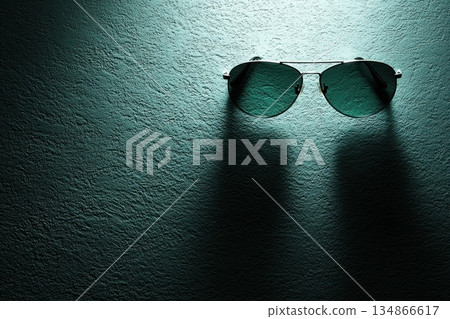 Stylish Designer Sunglasses Floating Diagonally with Light on Textured Background 134866617