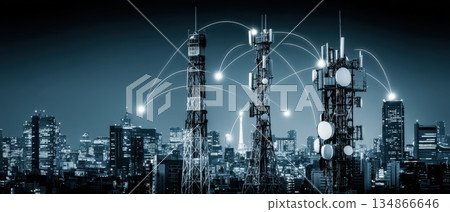 Digital Towers Emitting Electric Arcs into the Sky Over a Cityscape at Night 134866646