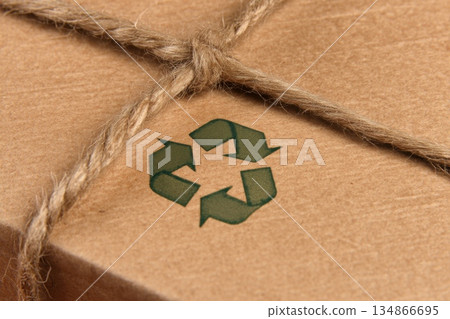 Close Up of Biodegradable Packaging with Recycling Symbol for Sustainable Fashion Products Close Up of Biodegradable Packaging with Recycling Symbol for Sustainable Fashion Products 134866695