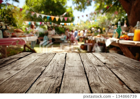 Weathered Wooden Tabletop Bathed in Soft Shadows on a Vibrant Outdoor Setting Weathered Wooden Tabletop Bathed in Soft Shadows on a Vibrant Outdoor Setting 134866739