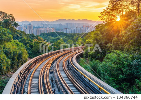 Futuristic Cargo Rail System Gliding Through Scenic Landscape at Sunset Futuristic Cargo Rail System Gliding Through Scenic Landscape at Sunset 134866744