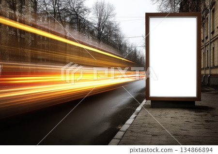 Empty Vertical Billboard on a Busy Street with Light Trails in the Background 134866894