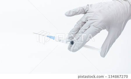 Medical professional in gloves holding a syringe with a clear background, symbolizing healthcare, vaccination, and medical procedures Medical professional in gloves holding a syringe with a clear background, symbolizing healthcare, vaccination, and medical procedures 134867270