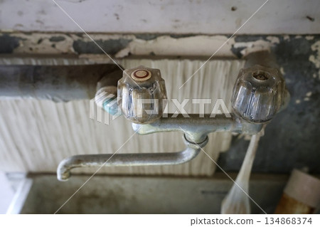 Faucet in an old house 134868374