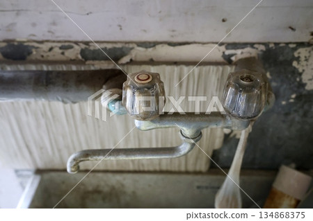 Faucet in an old house Faucet in an old house 134868375