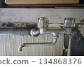 Faucet in an old house 134868376