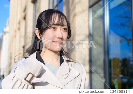 A woman commuting in the office district A woman commuting in the office district 134868514