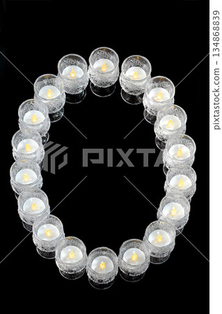 Letter O made of candles Letter O made of candles 134868839