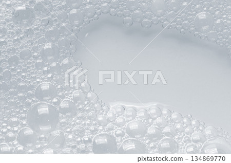 Bubbles of body gel or soap foam or shaving gel. Closeup. Copy space 134869770