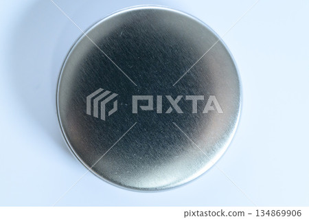 Macro overhead shot of a round metal lid Macro overhead shot of a round metal lid 134869906
