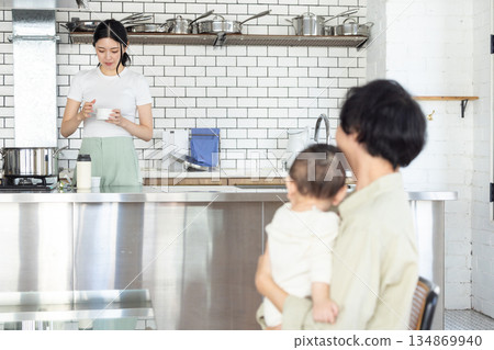 Dad holding a baby 134869940