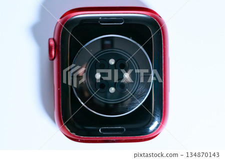 Close-up of the biometric sensor on the back of a smartwatch 134870143