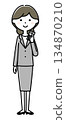 A woman with a suit with a smartphone 134870210