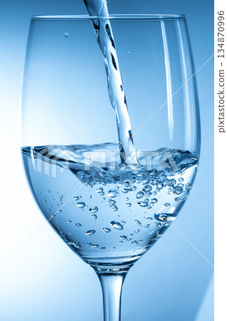 pour water into a cup pour water into a cup 134870996