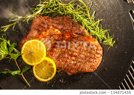 Grill a steak over an outdoor Grill a steak over an outdoor 134871438