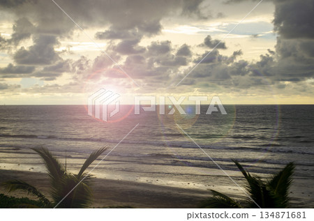 Low sun glow over wet sand and water, creating a soft pink highlight near dusk, Kuala Penyu, Sabah, Malaysia. Low sun glow over wet sand and water, creating a soft pink highlight near dusk, Kuala Penyu, Sabah, Malaysia. 134871681