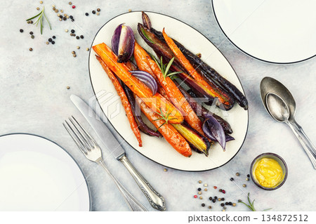 Honey glazed carrots on table. 134872512