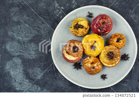 Homemade baked apples on a concrete kitchen table 134872521