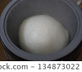 Glutinous rice being processed in a mochi-making machine 134873022