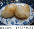 A simple Japanese dish of mochi rice cakes served with grated daikon radish 134873023