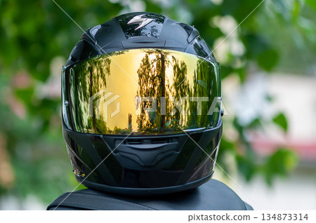 Biker helmet on a bike Biker helmet on a bike 134873314