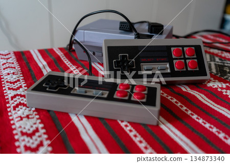 Retro games console on a wooden table 134873340
