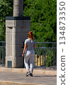 Woman walking on the street 134873350