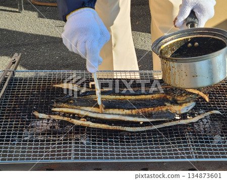 Demonstration and sale of grilled wild eel Demonstration and sale of grilled wild eel 134873601