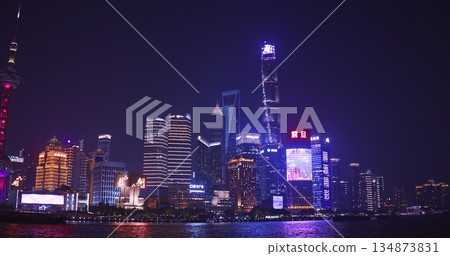 Nighttime of Shanghai Skyline Showing Brilliant Colors on Water Reflections Nighttime of Shanghai Skyline Showing Brilliant Colors on Water Reflections 134873831