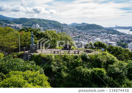 View of the Sakamoto Ryoma statue and Nagasaki cityscape from the Kazagashira Park Observatory 134874438