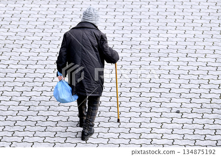 Yokohama cityscape in Japan: Walking sticks are a killer on the sidewalks... Hard-to-see undulations, steps, and unevenness... Elderly people with walking sticks need to be careful... Four-wheeled carts, etc. Yokohama cityscape in Japan: Walking sticks are a killer on the sidewalks... Hard-to-see undulations, steps, and unevenness... Elderly people with walking sticks need to be careful... Four-wheeled carts, etc. 134875192