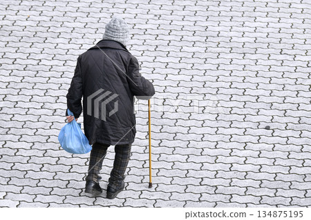Yokohama cityscape in Japan: Walking sticks are a killer on the sidewalks... Hard-to-see undulations, steps, and unevenness... Elderly people with walking sticks need to be careful... Four-wheeled carts, etc. 134875195