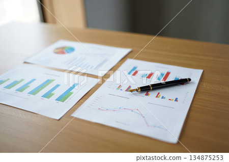 financial charts on the table in the office financial charts on the table in the office 134875253