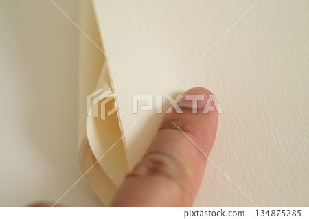 hand holding book on wood 134875285