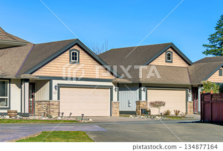 Row of nice residential houses on bright winter day in British Columbia, Canada Row of nice residential houses on bright winter day in British Columbia, Canada 134877164