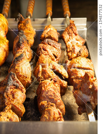 A ruddy kebab is being grilled on a barbecue 134877532