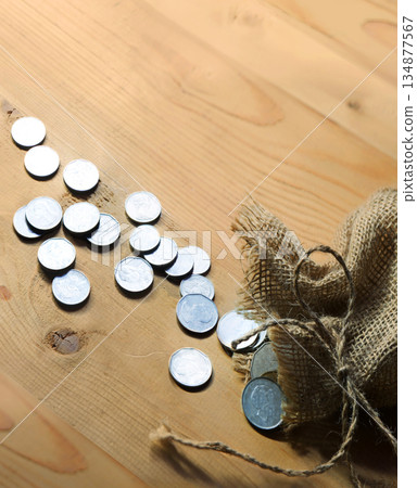 Silver coins in the bag Silver coins in the bag 134877567