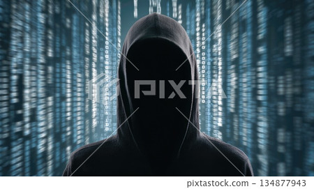 Anonymous Hooded Figure Surrounded by Digital Code Symbolizing Cyber Attack and Hacking 134877943