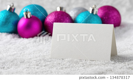 Blank Greeting Card Mockup with Colorful Christmas Ornaments on Snow Background Blank Greeting Card Mockup with Colorful Christmas Ornaments on Snow Background 134878317