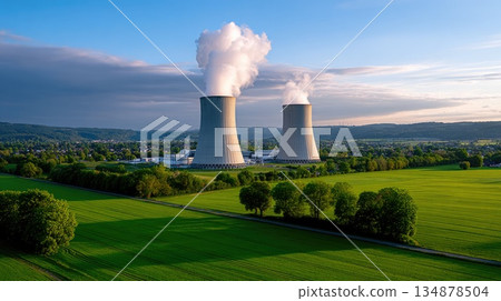 Nuclear Power Plant Cooling Towers Emitting Steam Over Green Rural Landscape Nuclear Power Plant Cooling Towers Emitting Steam Over Green Rural Landscape 134878504