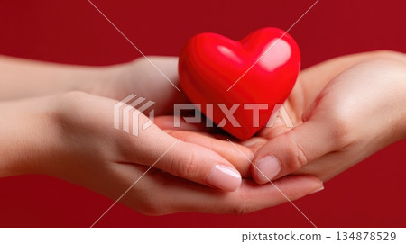 Hands Holding Red Heart Symbol Representing Love and Care Hands Holding Red Heart Symbol Representing Love and Care 134878529